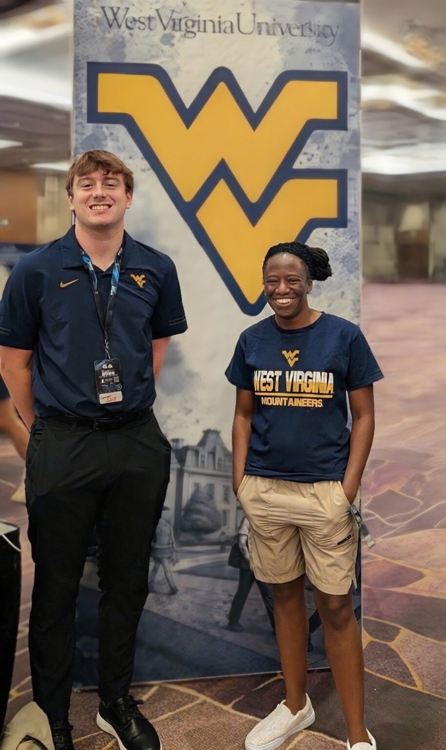 Shekinah Apedo with a West Virginia University student at an industry conference